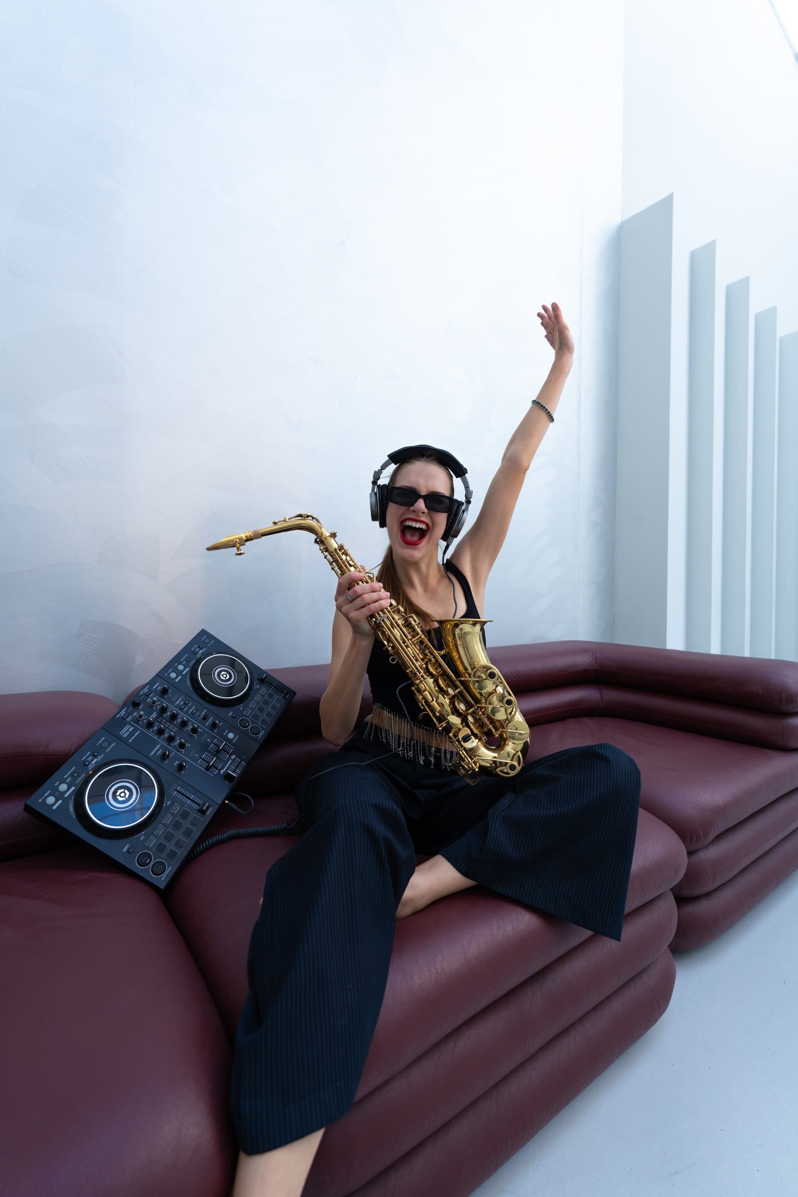 Violetta with DJ controller and saxophone
